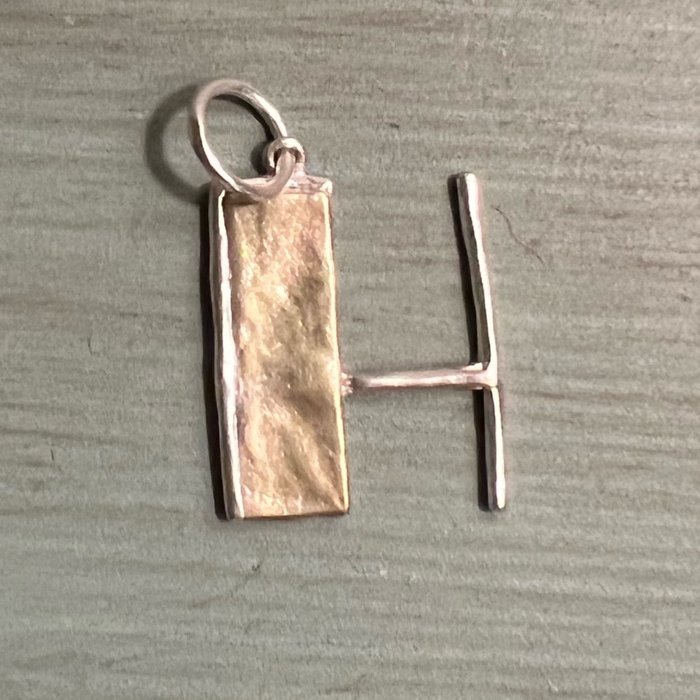Waxing Poetic Nomad Insignia “H”.